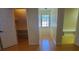 Bedroom with hardwood floors, a window with blinds, and closet at 2615 Southern Oaks Pl, Plant City, FL 33566