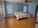 Bedroom with wood floors, blue walls, and lots of natural light at 2615 Southern Oaks Pl, Plant City, FL 33566