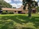 Exterior of the home with mature trees and landscaping at 2615 Southern Oaks Pl, Plant City, FL 33566