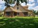 View of the home's exterior featuring brick and siding at 2615 Southern Oaks Pl, Plant City, FL 33566