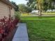 Manicured front yard with walkway and landscaping at 2615 Southern Oaks Pl, Plant City, FL 33566