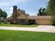 Home featuring two-car garage, brick accents and a spacious driveway at 2615 Southern Oaks Pl, Plant City, FL 33566
