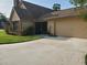 Home featuring two-car garage and a well-maintained driveway at 2615 Southern Oaks Pl, Plant City, FL 33566