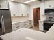 Bright kitchen features white cabinets, stainless steel appliances, and a light countertop at 2615 Southern Oaks Pl, Plant City, FL 33566