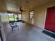 View of a cozy screened porch, perfect for outdoor relaxation and entertaining at 2615 Southern Oaks Pl, Plant City, FL 33566