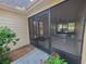 View of the entry screened-in porch with tiled flooring and neutral paint at 2615 Southern Oaks Pl, Plant City, FL 33566
