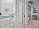 Bathroom featuring bathtub and toilet inside of an open doorway with mirrored closet at 2665 Sequoia Ter # 306, Palm Harbor, FL 34683