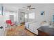 Bright bedroom with natural light, ceiling fan, decorative rug and artwork at 2665 Sequoia Ter # 306, Palm Harbor, FL 34683