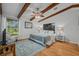 Spacious bedroom with beamed ceilings, ceiling fan, and inviting decor creating a warm, comfortable atmosphere at 2665 Sequoia Ter # 306, Palm Harbor, FL 34683