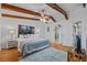 Spacious bedroom with beamed ceilings, ceiling fan, and inviting decor creating a warm, comfortable atmosphere at 2665 Sequoia Ter # 306, Palm Harbor, FL 34683