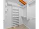 Bright walk-in closet with built-in shelving at 2665 Sequoia Ter # 306, Palm Harbor, FL 34683
