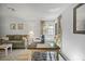 Open dining area with table set, window, and view to the living room space at 2665 Sequoia Ter # 306, Palm Harbor, FL 34683
