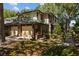 Charming townhouse with a brick facade, attached garage, and lush landscaping at 2665 Sequoia Ter # 306, Palm Harbor, FL 34683