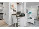 Home office or study space includes a desk, chair, and shelving at 2665 Sequoia Ter # 306, Palm Harbor, FL 34683