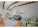 Bright living room with a beamed ceiling and hardwood floors at 2665 Sequoia Ter # 306, Palm Harbor, FL 34683
