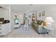 Comfortable living room with soft blue accents, a TV, and ample seating at 2665 Sequoia Ter # 306, Palm Harbor, FL 34683