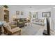 Comfortable living room and dining room combo with seating and natural light at 2665 Sequoia Ter # 306, Palm Harbor, FL 34683