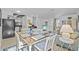 Open-concept dining and living space with lots of natural light at 2665 Sequoia Ter # 306, Palm Harbor, FL 34683