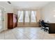 Bright and spacious office with large windows, tiled floors, and modern furnishings at 2724 Via Murano # 615, Clearwater, FL 33764