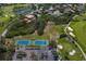 Beautiful aerial view of a community with golf course, lakes, tennis courts, and lush landscaping at 2817 Seabreeze S Dr, Gulfport, FL 33707