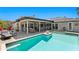 Waterfront backyard with a pool, covered patio, and outdoor lounge space at 2817 Seabreeze S Dr, Gulfport, FL 33707