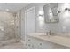 Bathroom featuring a vanity with a sink, a walk-in shower, and tiled floors at 2817 Seabreeze S Dr, Gulfport, FL 33707