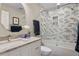 This bathroom boasts stylish tile, a soaking tub, and glass shower doors at 2817 Seabreeze S Dr, Gulfport, FL 33707