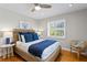 Inviting bedroom with a woven headboard, hardwood floors, and ample natural light at 2817 Seabreeze S Dr, Gulfport, FL 33707