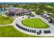 Pasadena Yacht & Country Club's clubhouse overlooks a green with golf carts ready for a day on the course at 2817 Seabreeze S Dr, Gulfport, FL 33707