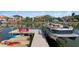 A boat is docked with kayaks at this home's private dock and canal at 2817 Seabreeze S Dr, Gulfport, FL 33707