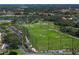 Aerial view of the Pasadena Yacht & Country Club's golf driving range framed by palm trees and lush landscaping at 2817 Seabreeze S Dr, Gulfport, FL 33707