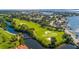 Aerial view of the pristine golf course at Pasadena Yacht & Country Club, surrounded by waterfront homes at 2817 Seabreeze S Dr, Gulfport, FL 33707