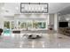 Modern kitchen featuring granite countertops, sleek cabinetry, and a view of the pool at 2817 Seabreeze S Dr, Gulfport, FL 33707