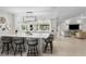 Bright and modern kitchen with marble countertops, eat-in bar, and scenic backyard views at 2817 Seabreeze S Dr, Gulfport, FL 33707