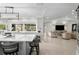 Bright, open kitchen featuring a large island, modern lighting, and views into the adjacent living area at 2817 Seabreeze S Dr, Gulfport, FL 33707