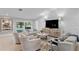 Bright living room with stylish decor, comfortable seating, and a view of the pool at 2817 Seabreeze S Dr, Gulfport, FL 33707