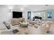 Beautiful living room with high ceilings, grand piano, and modern decor at 2817 Seabreeze S Dr, Gulfport, FL 33707