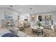 Open-concept living room with neutral tones, stylish furnishings, and ample natural light at 2817 Seabreeze S Dr, Gulfport, FL 33707
