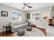 A cozy room with bright windows, hardwood floors, and a comfortable couch at 2817 Seabreeze S Dr, Gulfport, FL 33707