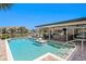 Inviting pool with covered patio, canal view, and comfortable outdoor seating at 2817 Seabreeze S Dr, Gulfport, FL 33707