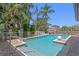Beautiful pool with a spa and serene waterfront views of the community at 2817 Seabreeze S Dr, Gulfport, FL 33707