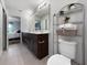 Modern bathroom with double vanity, tiled floors, and toilet at 2874 Deer Pine Trl, Land O Lakes, FL 34638
