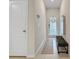 Inviting foyer with a bench and mirror adjacent to the front door with natural lighting at 2874 Deer Pine Trl, Land O Lakes, FL 34638