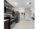 Modern kitchen featuring stainless steel appliances, tile flooring and lots of storage at 2874 Deer Pine Trl, Land O Lakes, FL 34638