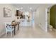 Open-concept kitchen and dining area with seating at counter height at 2874 Deer Pine Trl, Land O Lakes, FL 34638