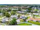 Aerial view of the neighborhood featuring the house with solar panels, garage and backyard at 2912 Case Ave, Bradenton, FL 34207