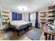 Bedroom with wooden shelving, wood-look tile floors, and dragonfly decorations on the ceiling at 2912 Case Ave, Bradenton, FL 34207