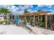 This home features a unique trellis and artistic front yard with rock features and a charming display at 2912 Case Ave, Bradenton, FL 34207