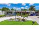 Charming home featuring a landscaped front yard, unique rock features, and a welcoming trellis entrance at 2912 Case Ave, Bradenton, FL 34207