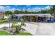 Charming home featuring a landscaped front yard, unique rock features, and a covered carport at 2912 Case Ave, Bradenton, FL 34207